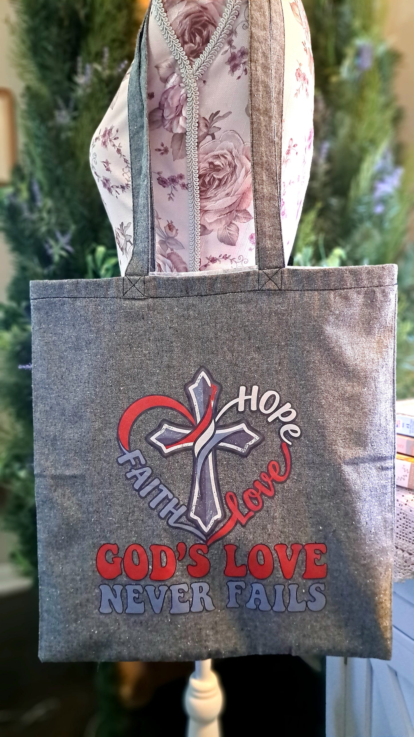 Lt. Gray God's Love Never Fails Tote Bag